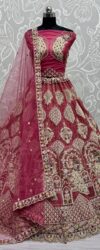 Elegant Raspberry Net Lehenga Choli with Majestic Peacock Work